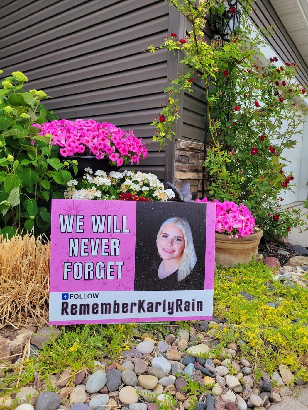 "We Will Never Forget" yard sign supporting the Karly Rain Wood Act, with a link to follow Remember Karly Rain